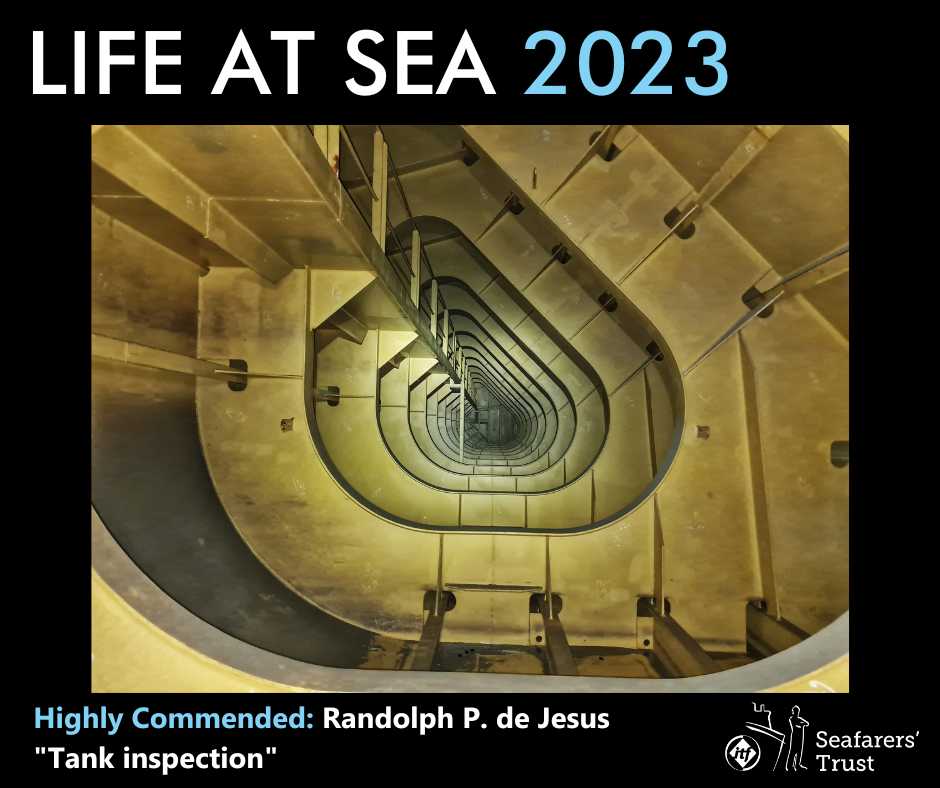 A graphic showing a Highly Commended Prize photo on a black background with text reading Life At Sea 2023 Highly Commended Randolph P. De Jesus "Tank Inspection". The photo shows a view into the ballast tank of the ship, within the superstructure of the ship. The curved bracing structures within the tank are in a shape similar to a capital letter D. As you look through the tank the braces make a repetitive pattern, each one smaller than the last, making it almost look like a spiral staircase going down and disguising the actual orientation of the view shown in the photograph.