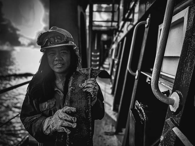 A person wearing a helmet and holding a fish
AI-generated content may be incorrect.