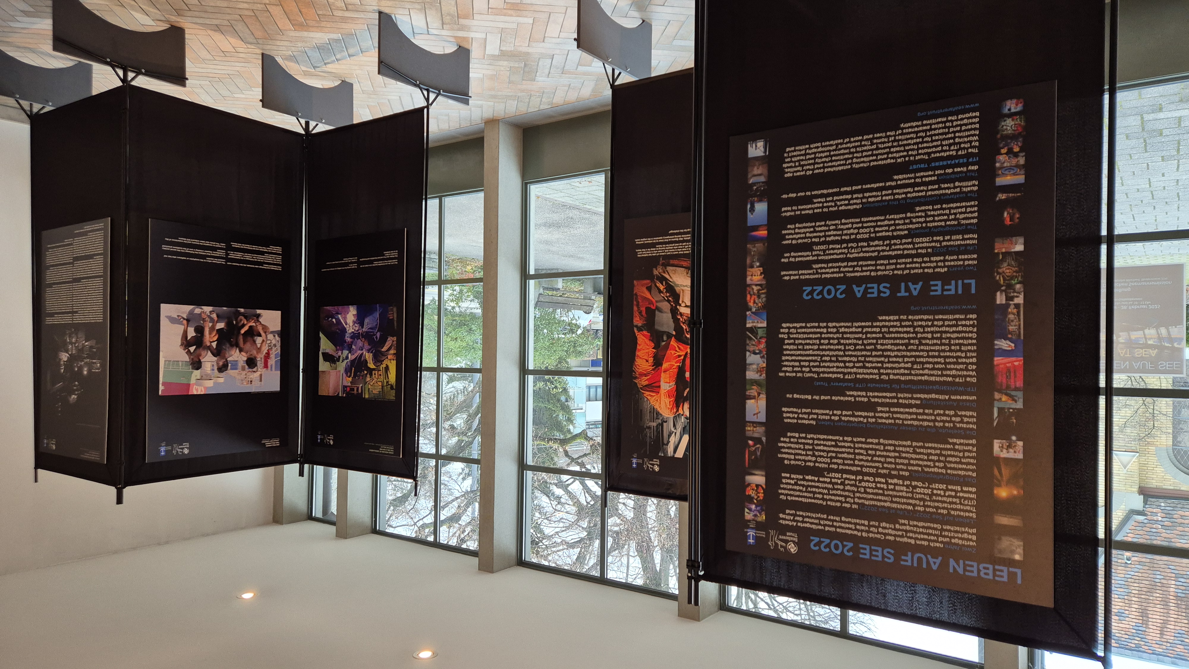 Life at Sea photographs and text exhibited in large metal stands